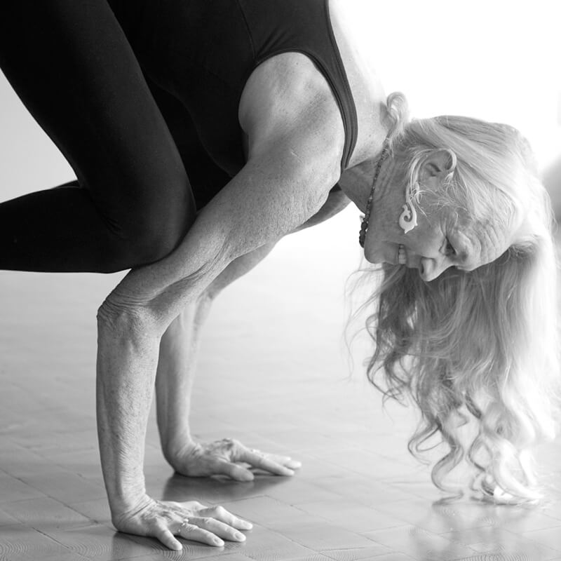Elderly woman in yoga pose